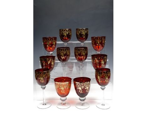 Six ruby and gilt wine glasses together with six wine goblets