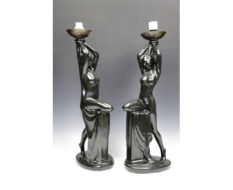 A pair of Art Nouveau influenced black glazed ceramic figural table lamps, 52 cm