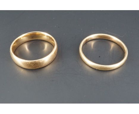 An 18 ct gold wedding band, K, 3.3 g, together with a 9 ct band, N, 1.4 g
