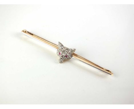 An early 20th century diamond and ruby fox mask brooch, the fox pave set with rose cut diamonds and cabochon ruby eyes, stamp