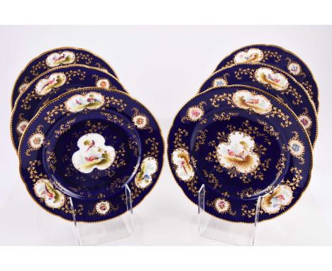 A set of six Coalport dessert plates, early 20th century, painted with fancy birds by Frederick Howard, in gilt lined cartouc