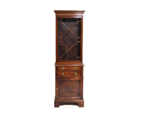 A George III mahogany bookcase cabinetOf narrow proportions, the astragal glazed bookcase top above two cock-beaded drawers a
