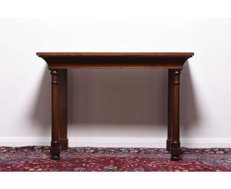 A William IV mahogany side tableThe plain top above a cavetto frieze, raised on ring-turned front supports.114cm wide x 56cm 