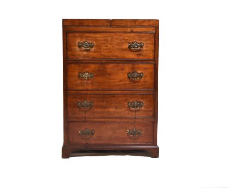 A George III mahogany wash standThe twin flap top opening to recesses for washbowl and dishes and retractable swing toilet mi