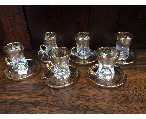 Six Interglass gilded glass cups and saucers (12)