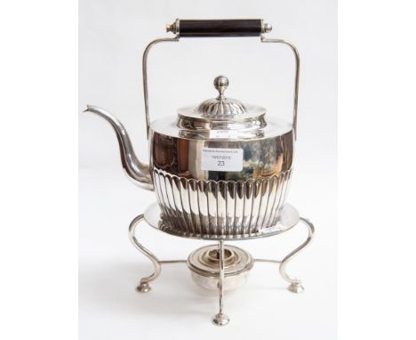 A silver plated teapot with stand