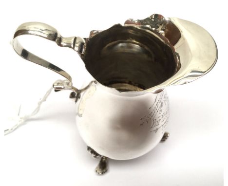 A silver cream jug, approx 2.67ozt, Walker & Hall, Birmingham 1899, rubbed hall mark, engraved Tickford Park which is pre run