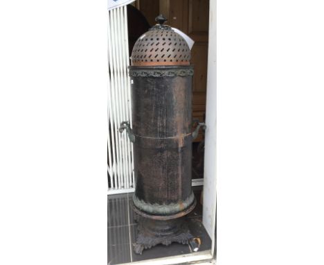 A Victorian Charcoal heater, having an elaborate cast iron pedestal base, twin handles, cast decoration to the exterior and a