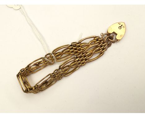 A 9ct rose and yellow gold gate bracelet with textured links and padlock clasp, approx 13 grams 