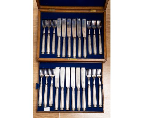 A set of twelve Victorian silver entree knives and forks, beaded handles with engraved tines and blades, H.H., Sheffield, 187