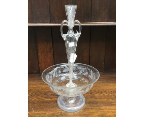 A Victorian epern wheel etched foliate design, having pedestal bowl stand with a twin handled central vase 