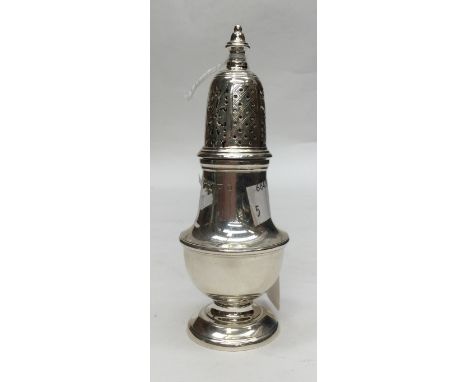 A George II style silver baluster shaped pepper pot, the cover pierced with geometric pattern beneath baluster finial, George