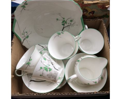 A Shelley, mid 1920s 21 piece tea service, tree design with green painted foliage 