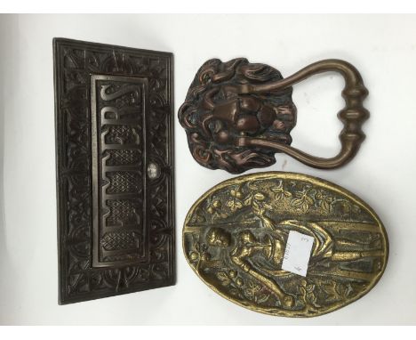 A collection of brassware, including a novelty trinket dish depicting a saucy lady, a Georgian style lions mask door knocker 