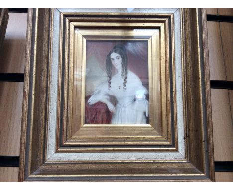 A pair of 19th Century portrait miniatures on ivory, of young ladies framed (2)