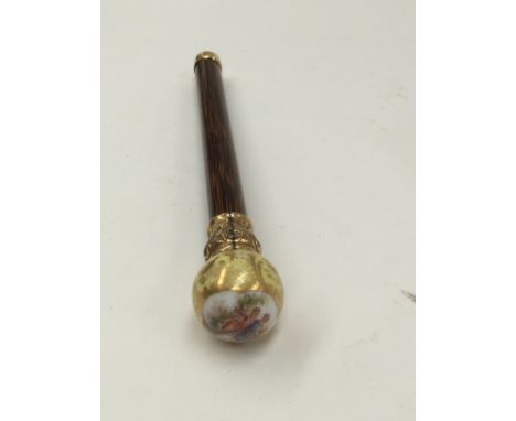 A French parasol handle with porcelain finial painted courtly couple within yellow and gilt border and gilt collar