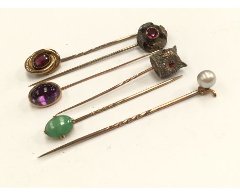 A stick pin, the finial cast as Owl's head and five others, set cultured pearl, jade, garnet, etc (6) 