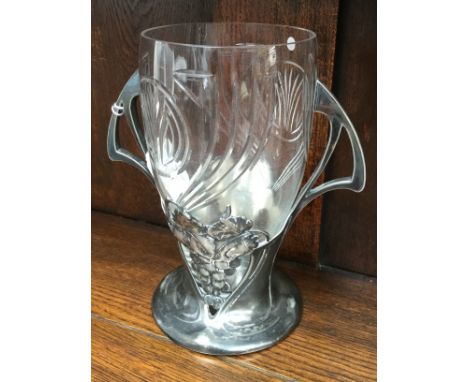 A W.M.F. plated Art Deco twin handled stand, holding cut glass vase, the stand depicting vine and grapes, the cut glass vase 