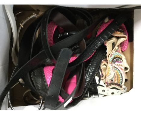 A collection of designer belts in leather, one has beadwork in a colourful array and metal button (q) 