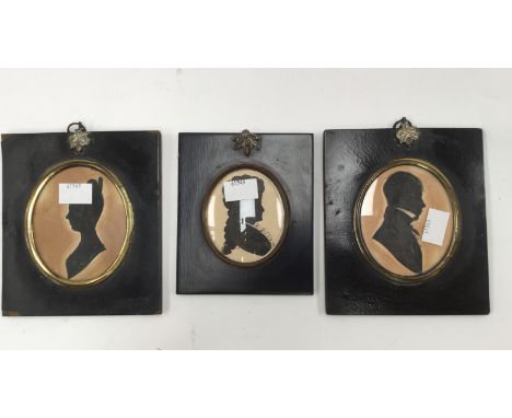 Three black framed portrait miniatures, depicting silhouettes of Georgian figures (3) 