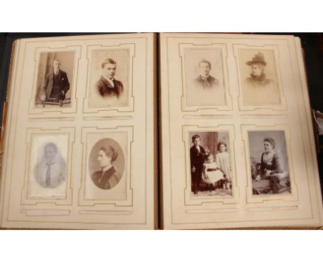 A Victorian leather bound photograph album, enclosing portrait photo's; together with a Victorian family Bible (2) 