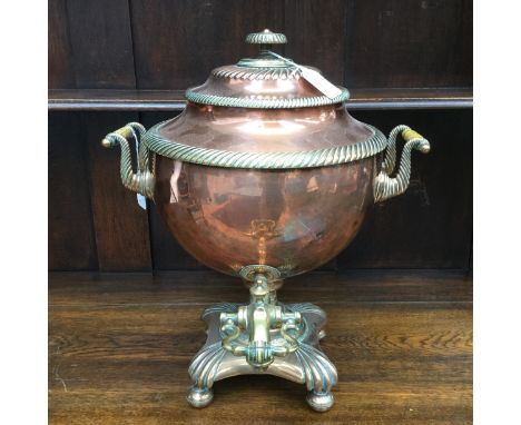 A copper samovar, early 19th Century ivory handles, brass plinth, top, finial and decoration 