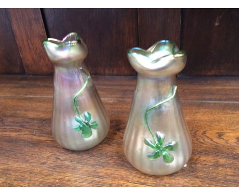 A pair of Loetz iridescent ribbed vase, having green floral decoration and rim 