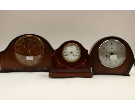 Inlaid desk timepiece, enamel face, Roman numerals, Swiss movement; together with Smiths Westminster chime clock in oak and a