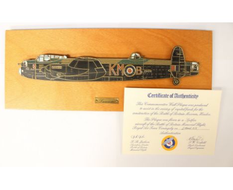 A boxed plaque of a Lancaster Bomber on a wooden mount produced by RAFA in 1978. Complete three certificates of authenticity 