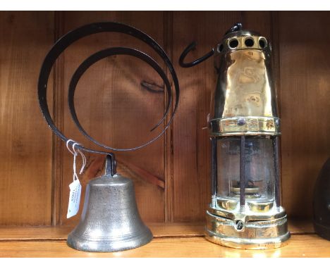 A 19th Century brass minors lamp and a Victorian bell (2)