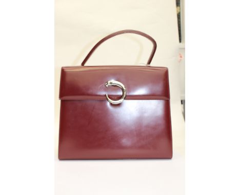 CARTIER Panthere Bordeaux structured handbag, burgundy leather, top handle, flap closure featuring iconic Cartier Panther C c