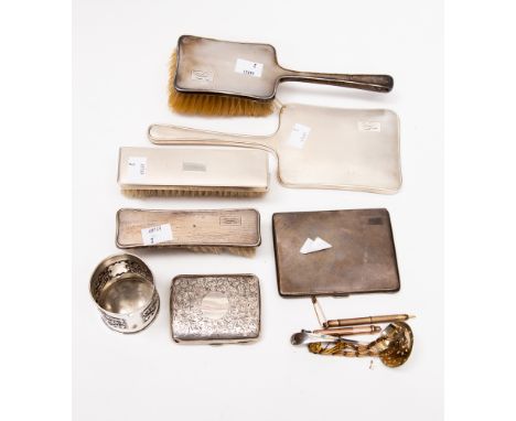An Edward VIII silver backed mirror and brush, Birmingham, engine turned, another pair of silver backed brushes, two silver c