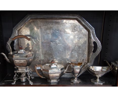 A late Victorian silver five piece octagonal tea service and tray, comprising teapot, kettle on stand with plate burner, suga