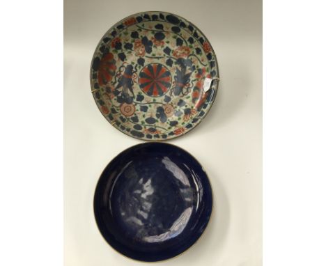 A Chinese Kangxi Imari charger and a similar Chinese bowl with powder blue ground, diameters, approx 37cm x  28cm (2)