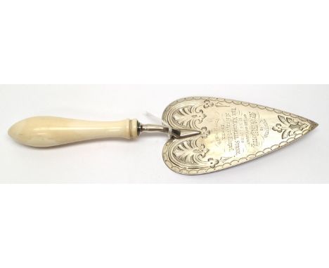  A Victorian silver presentation trowel, the blade engraved with geometric pattern surrounding presentation inscription: PRES