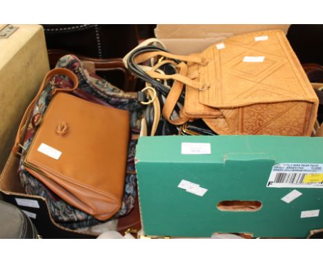 A collection of handbags to include a black bag with clip fastener, cream Lorenz square cream leather with two zips, South Am