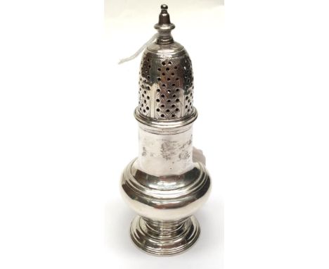  A George II silver plain baluster shaped pepper pot, the detachable cover with pierced geometric pattern beneath baluster fi