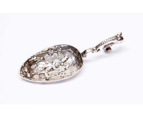 An embossed silver caddy spoon, Chester 1899, stamp B.M. total weight approx 1.01 ozt approx 