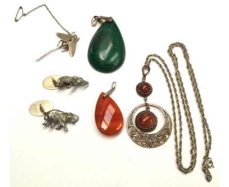 Five items of silver/white metal jewellery, comprising a pair of Elephant cufflinks, malachite and agate pendants and a fly s