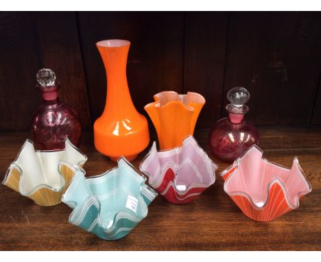 Four Chance glass handkerchief vases (in yellow, orange, green and red) with an orange vase, having fluted edge and a narrow 