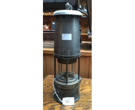 The Wolf Safety Lamp Co (WM Maurice) Ltd Sheffield Wolf no. 7.S, the miners lamp having a steel frame and brass middle, 29 cm