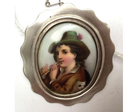 A white metal framed painted porcelain oval plaque, a flutist and dog (plaque 19th Century Continental) size approx 50mm x 45