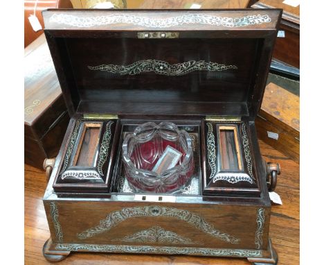 A mahogany tea caddy, inlaid with mother of pearl, original cut glass mixing bowl