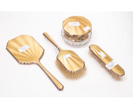 An Art Deco silver and enamel dressing table brush set, comprising hair brush, clothes brush, mirror and a silver and enamel 