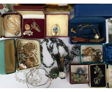 A collection of costume jewellery, to include a rolled gold locket and paste set chain, brooches, crystal bead and faux pearl