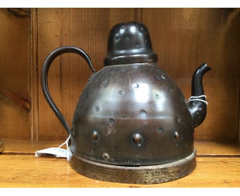 Goberg, a Jugendstil bronzed metal teapot or kettle, domed form with dimpled design, stamped name impressed name to base, 16c