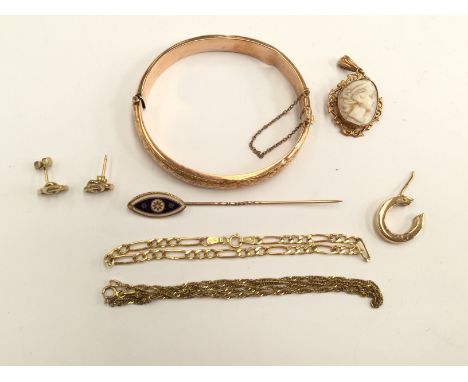 A collection of 9ct gold and yellow metal jewellery to include an enameled pin, a hollow bangle, celtic stud earrings, gold c
