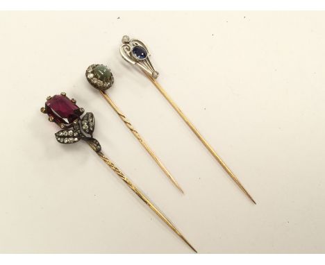 Three various Edwardian stick pins, set garnet and old cut diamonds, chrysoberyl and diamond cluster, etc (3) 