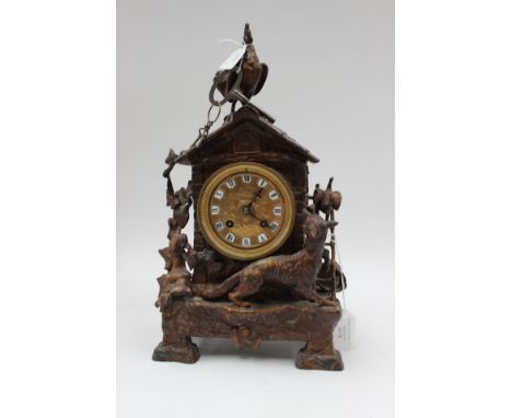 A Spelter mantel clock with fox and chicken scene and key 