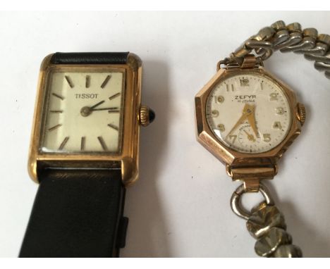 A lady's Zefyer 9ct octagonal gold cased cocktail watch together with a Tissot gold case and rectangular lady's watch, ruby c